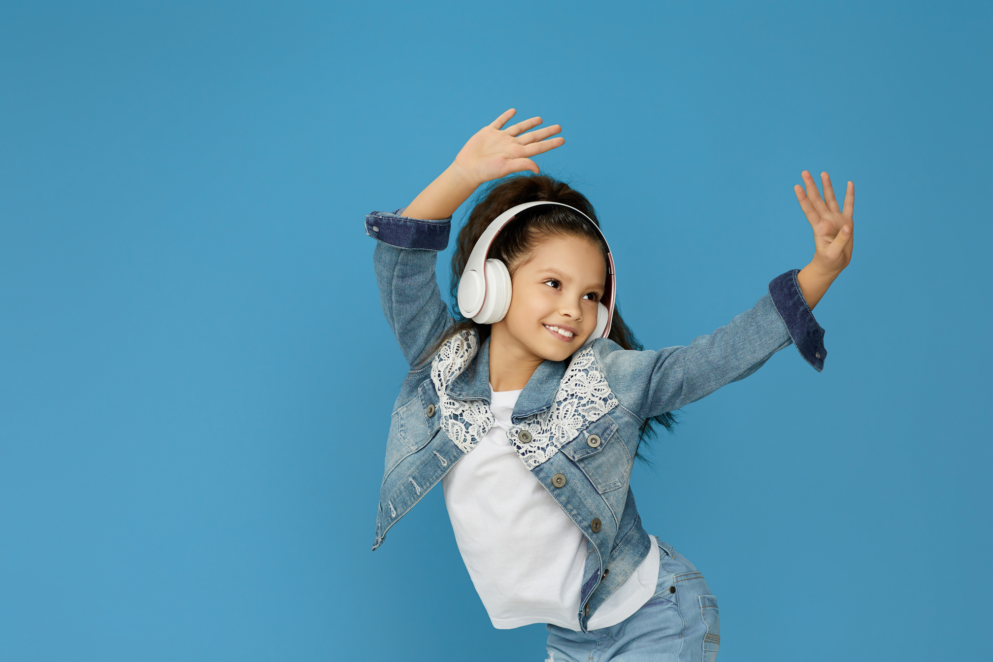 Little Child Girl in White Headphones Dancing